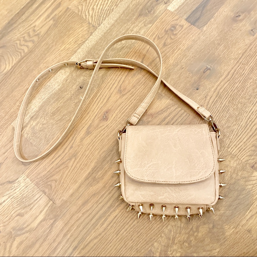 Tan crossbody purse with gold spikes